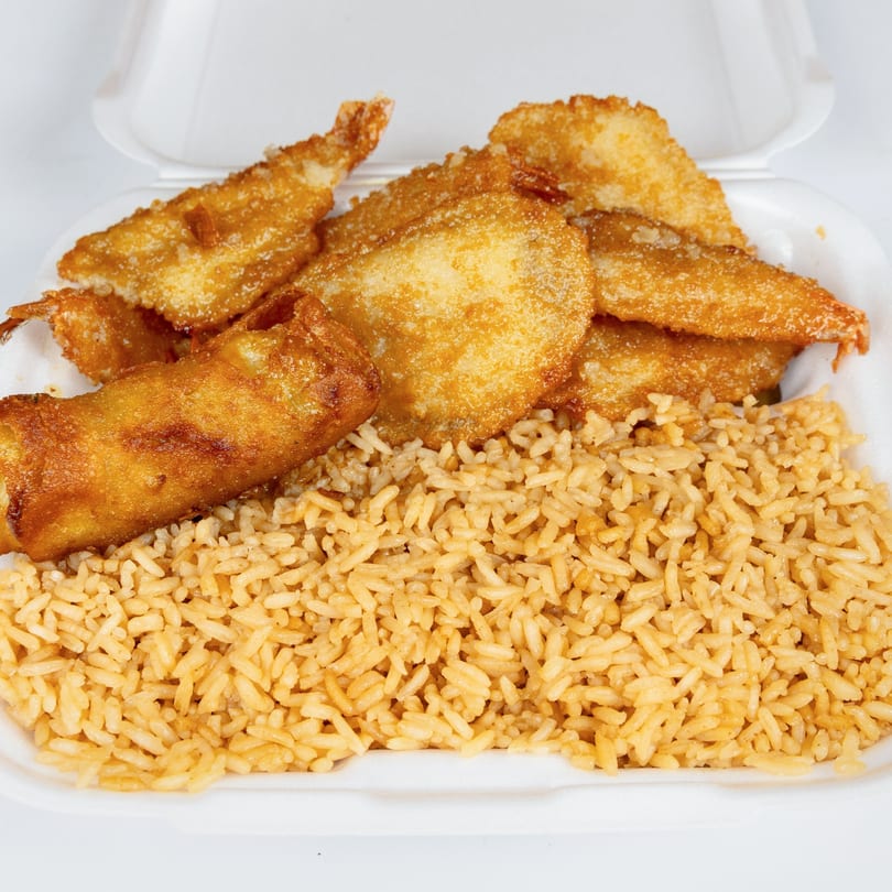 Kung Fu Wings' fried shrimp, egg roll, and fried rice in a white takeout container.